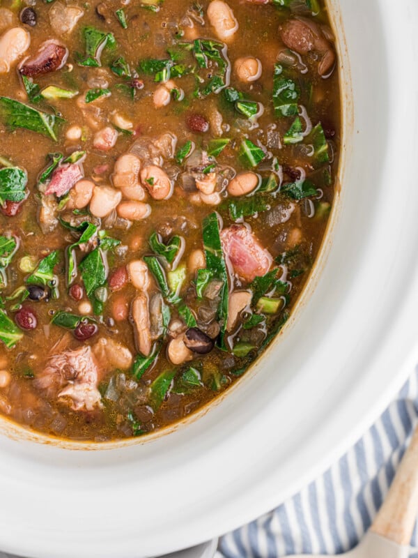 overhead shot of 15 Bean Soup with Ham and Collard Greens in a slow cooker.