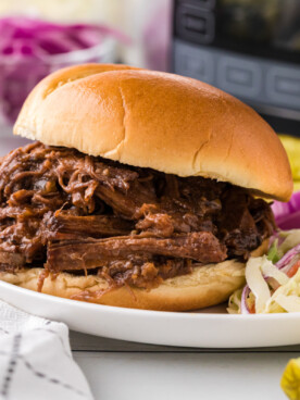 Barbecue beef on a hamburger bun.