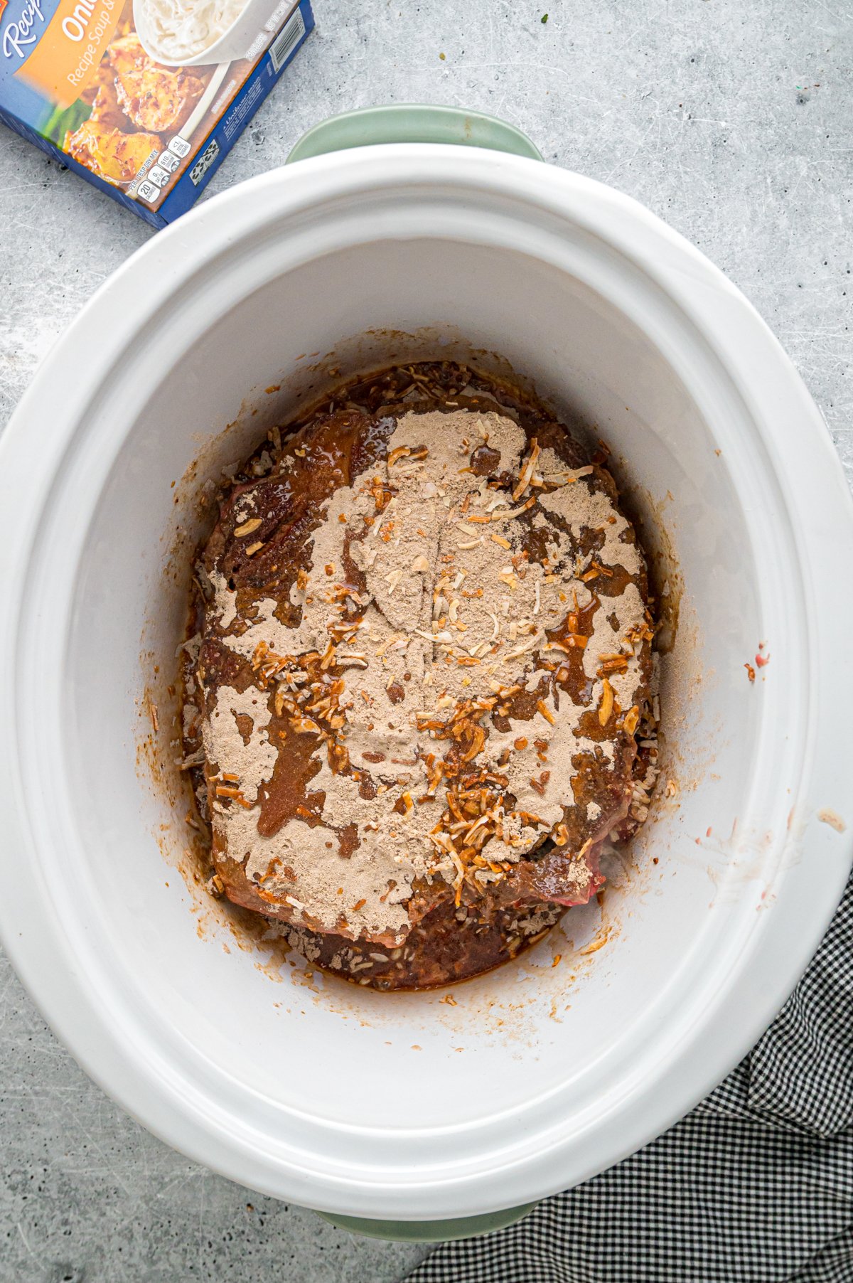 Ingredients for beef manhattan in a slow cooker.