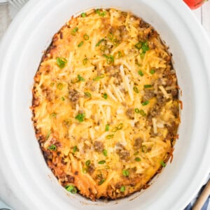 breakfast casserole in a white slow cooker.