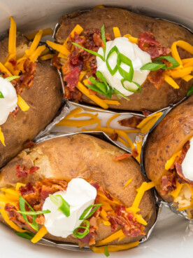 close up of baked potatoes in a crockpot.