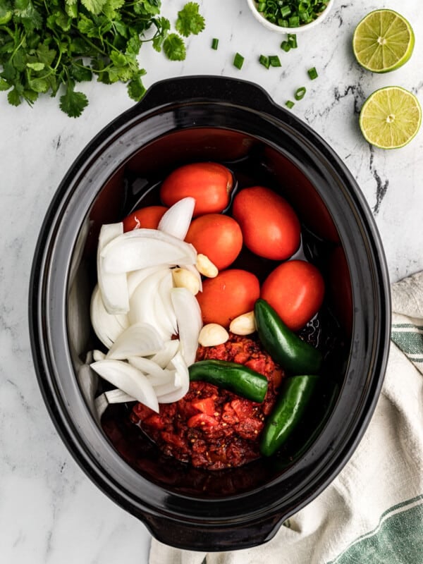 ingredients for salsa in a crockpot.