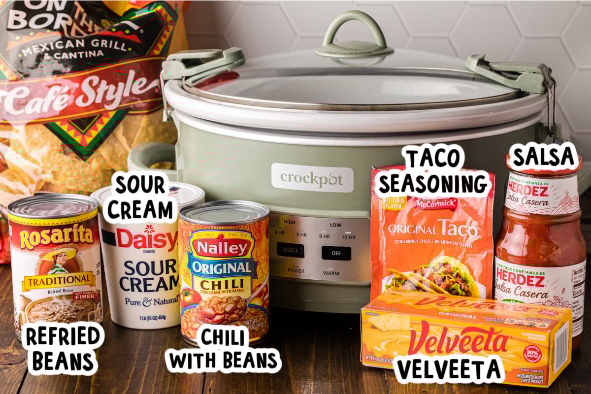 Ingredients for football dip in front of a crockpot.