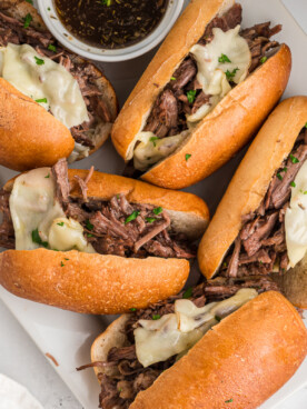 4 french dip sandwiches with au jus.