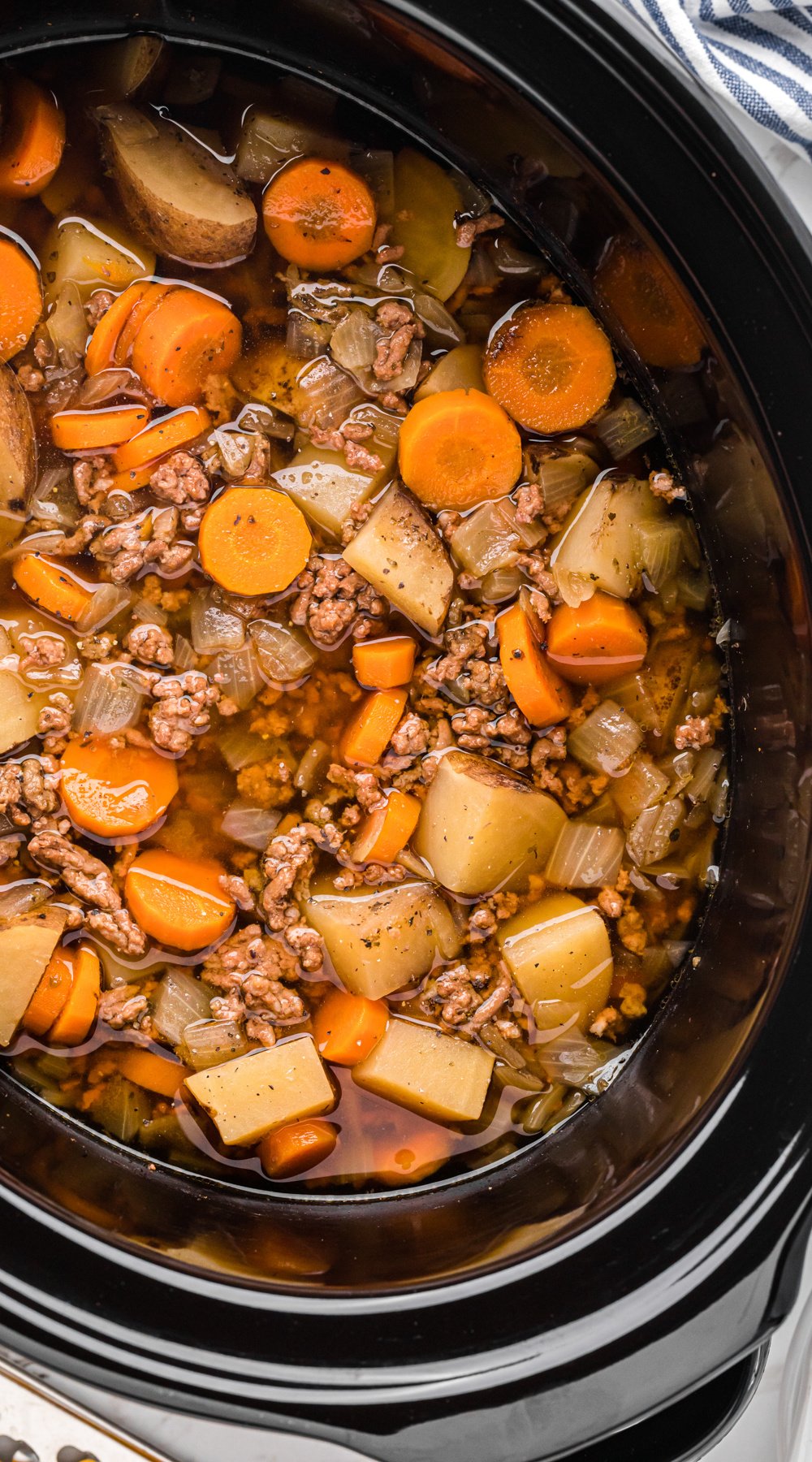 Long image of slow cooker hobo soup.