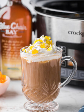 A mug filled with slow cooker hot buttered rum coffee.