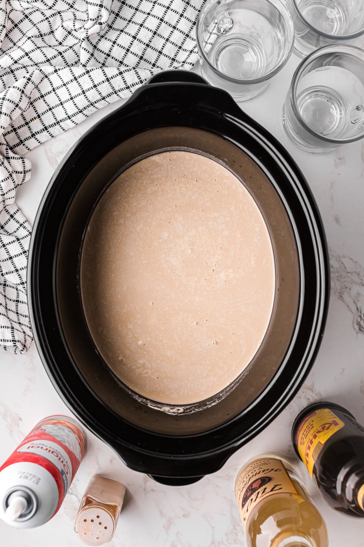 hot white russian mixture after cooking in a crockpot.