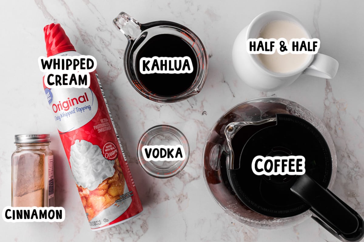 ingredients for slow cooker hot white russians on a table.