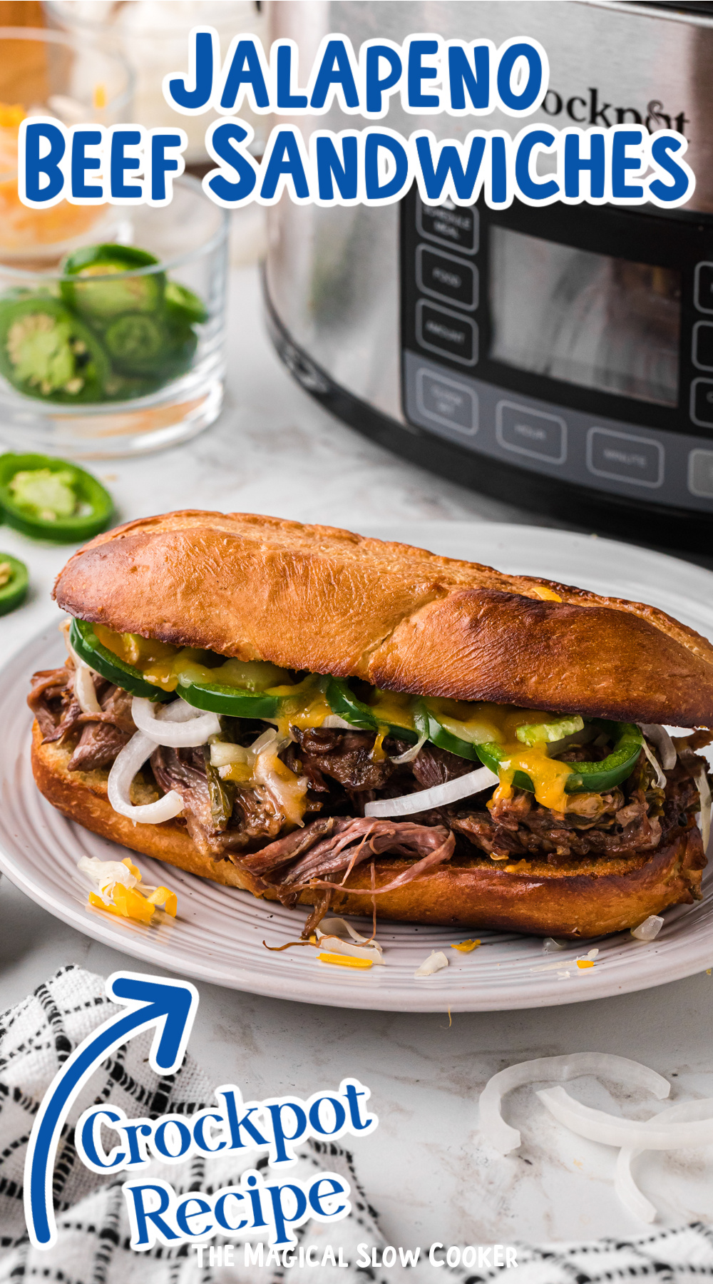jalapeno beef sandwich in front of a slow cooker.