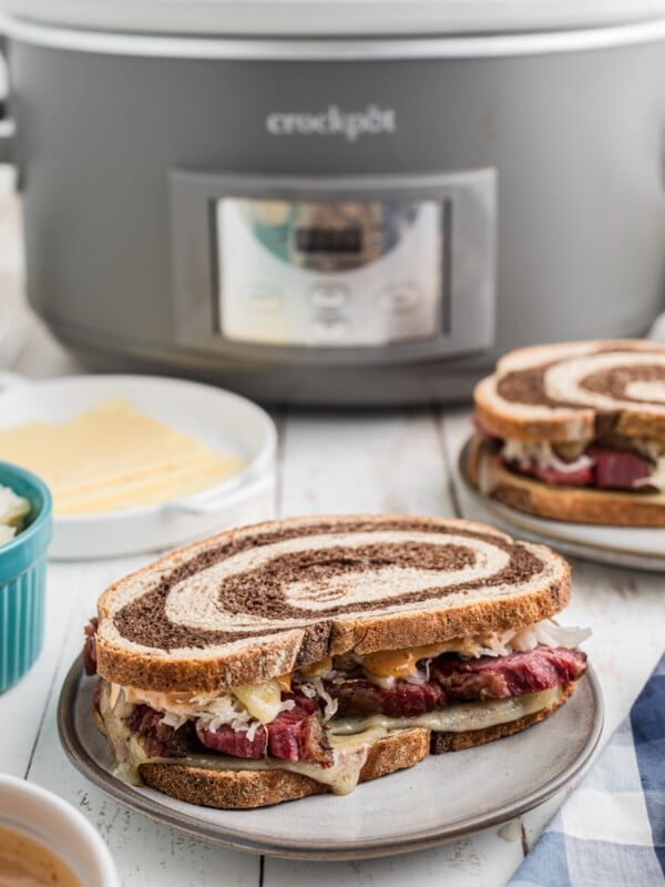 pastrami sandwich in front of a slow cooker.