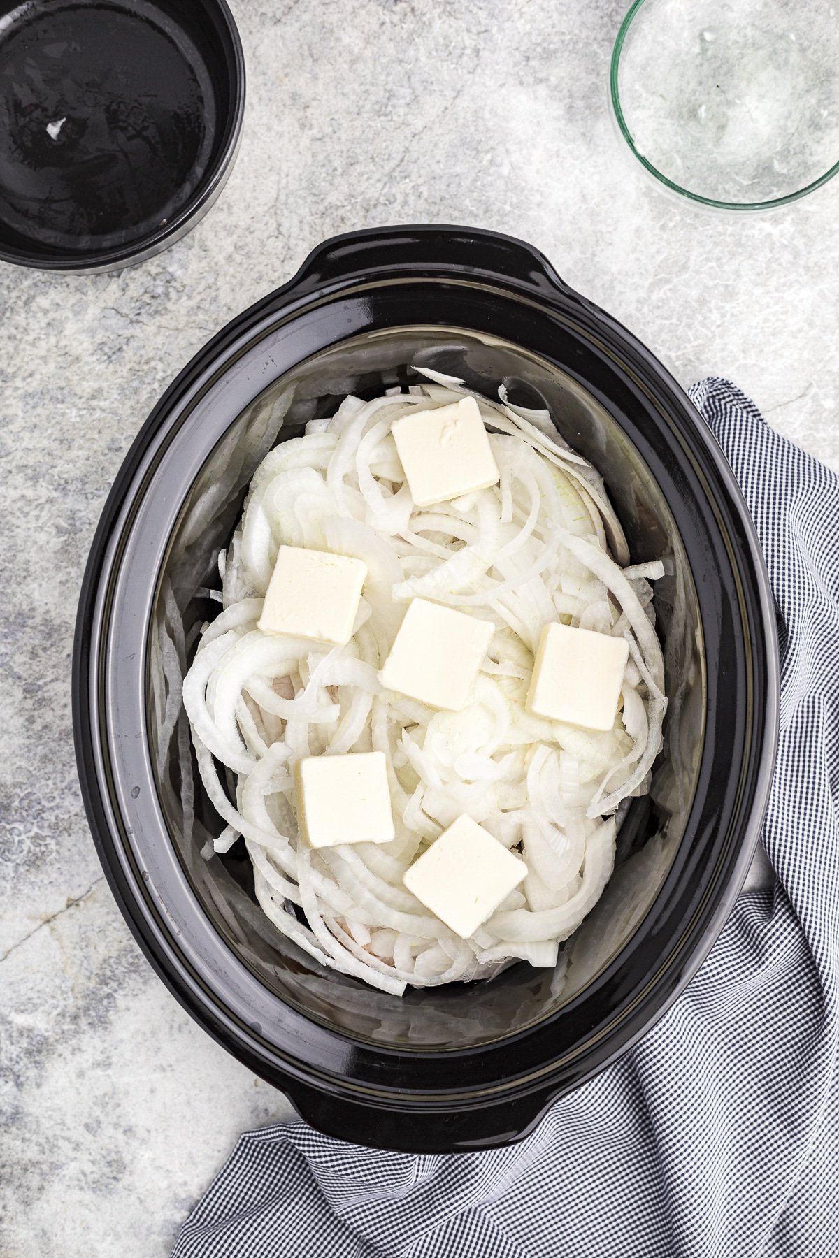 onions and butter on top of the pork chops