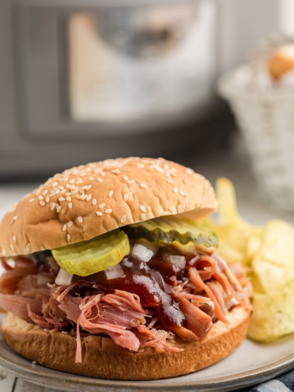 pulled ham sandwich on a plate.