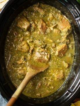 pork chunks cooked in slow cooker in a green chile sauce.