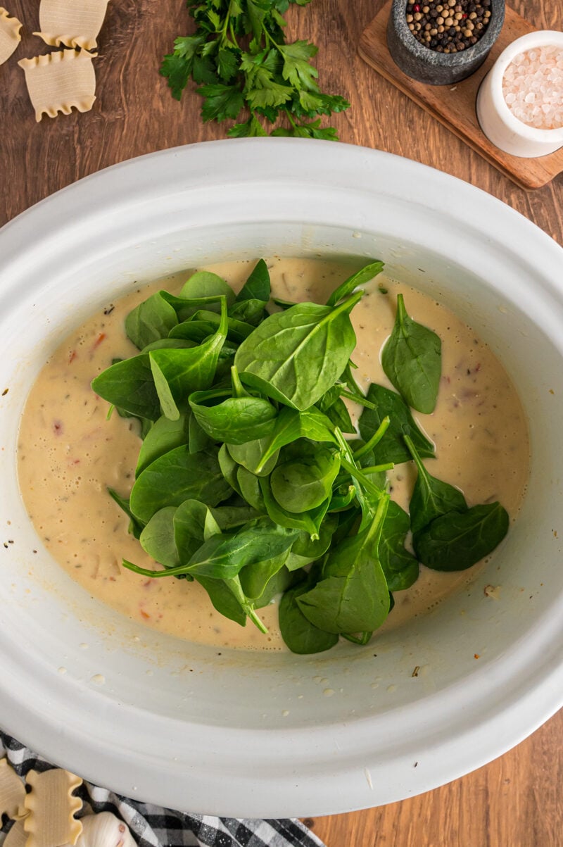 spinach and cream added to white lasagna soup.